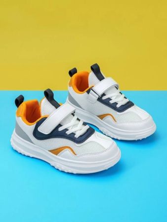 Sports shoes with adhesive tape for children